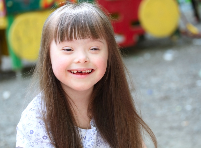 Portrait of beautiful young girl on the playground.